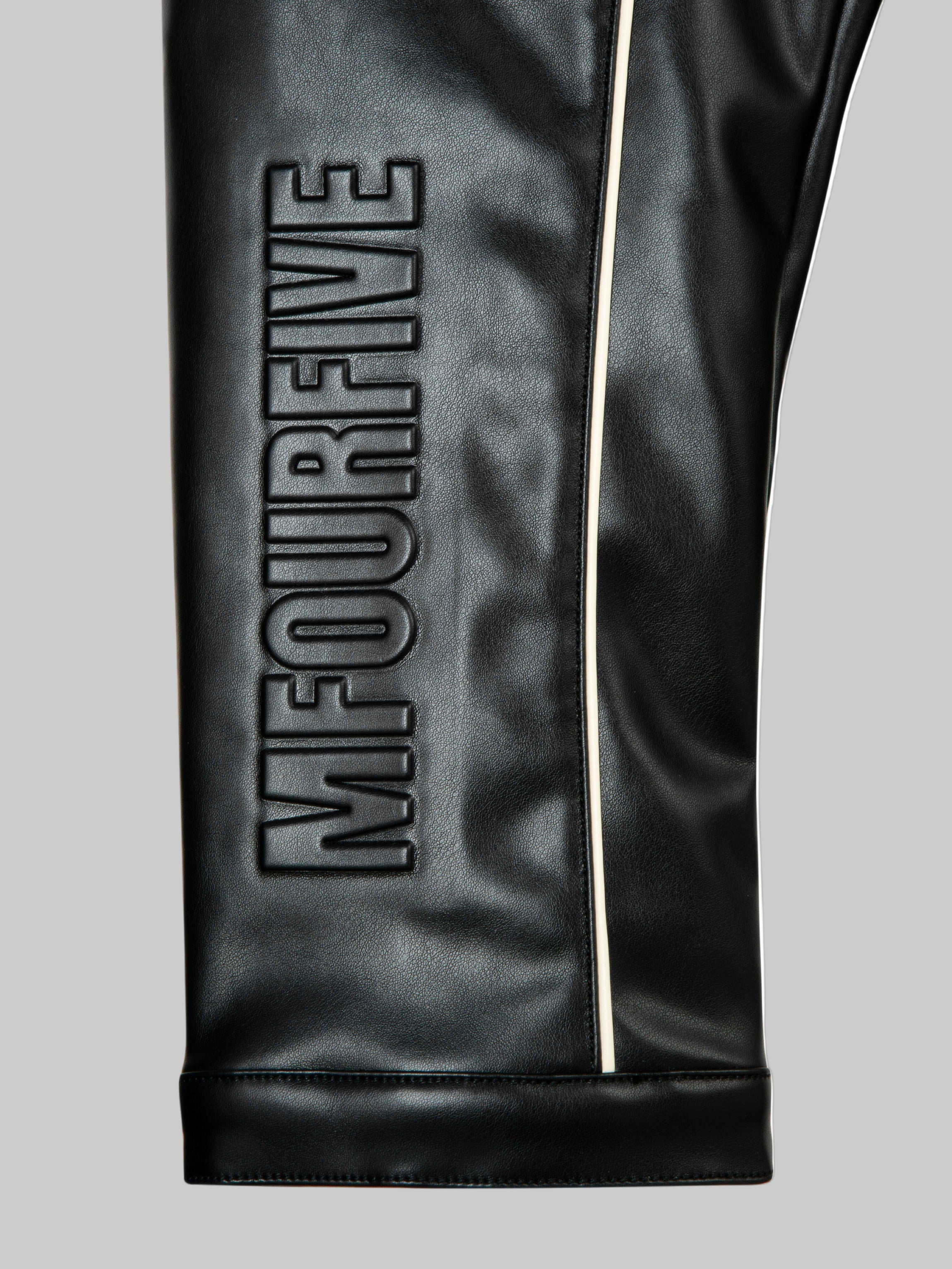 Detail shot of premium leather texture on M45 Black Leather Jacket - mfourfive luxury boxy fit streetwear