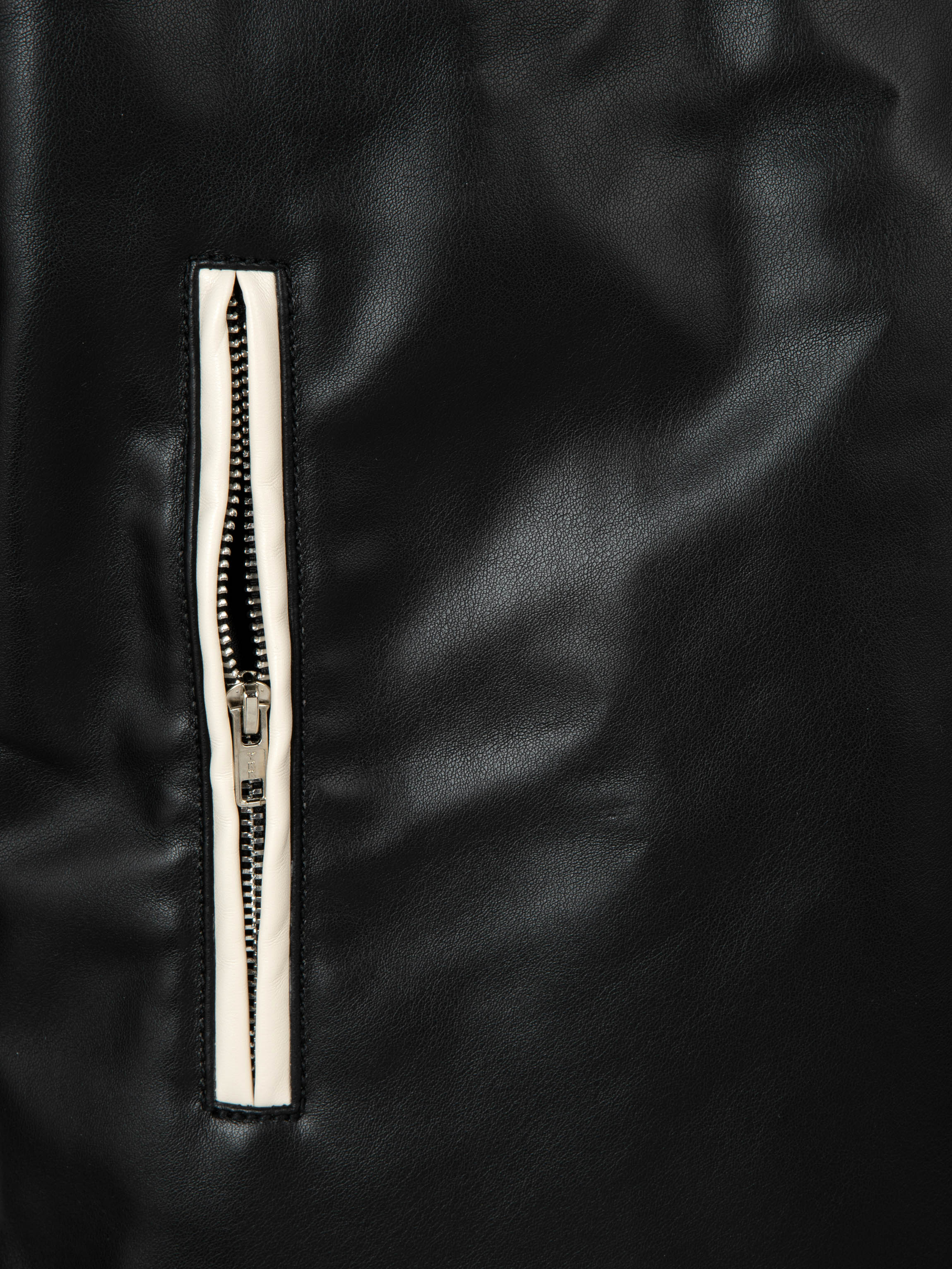 Detail shot of premium leather texture on M45 Black Leather Jacket - mfourfive luxury boxy fit streetwear