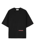 Front view of a black Mfourfive oversized t-shirt with distressed holes at the collar and bottom hem, featuring an offset red gothic Mfourfive logo printed on the lower side.