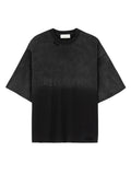 Front view of a washed black Mfourfive oversized t-shirt featuring distressed holes at the collar and bottom hem, with a subtle tonal black gothic logo printed across the center chest.